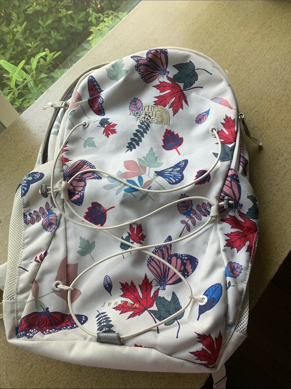 The North Face White Backpack with Red & Blue Butterfly Leaf Print